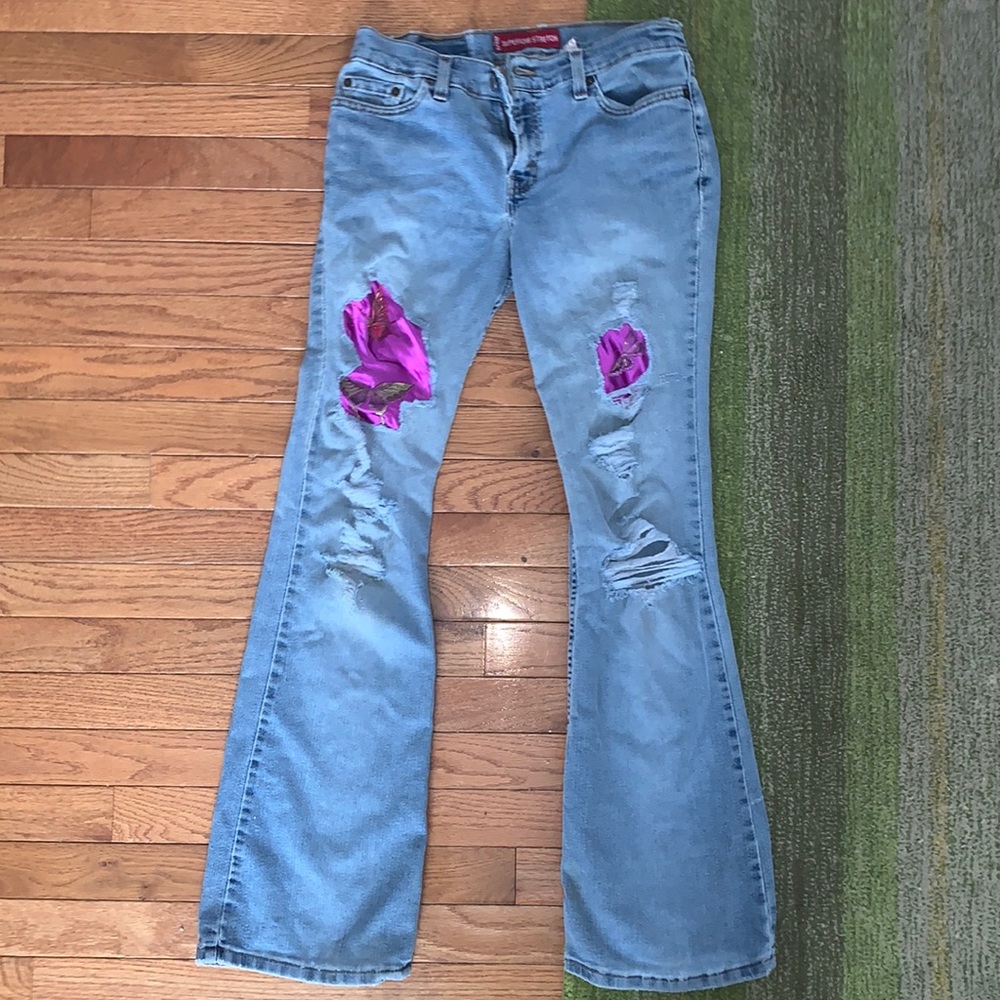 Levi’s distressed super low jeans, one of a kind patches!!